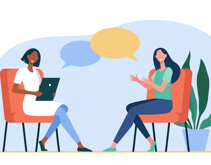 Happy Women Sitting And Talking To Each Other